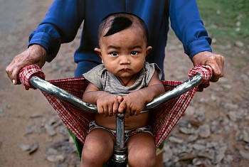 Steve McCurry - Steve McCurry Baby in a Bicycle Sling
