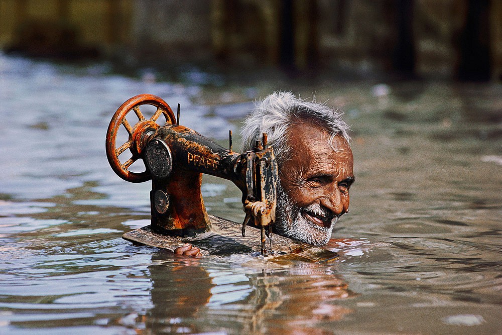 Steve McCurry, Man with Sewing Machine, 1983
FujiFlex Crystal Archive Print, (Inquire for sizes)
INDIA-10004NF