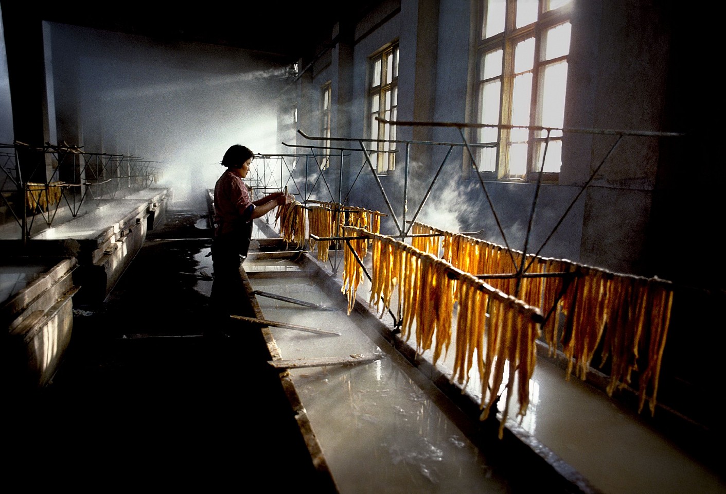 Steve McCurry, Woman Prepares Noodles, 1984
FujiFlex Crystal Archive Print
Price/Size on request