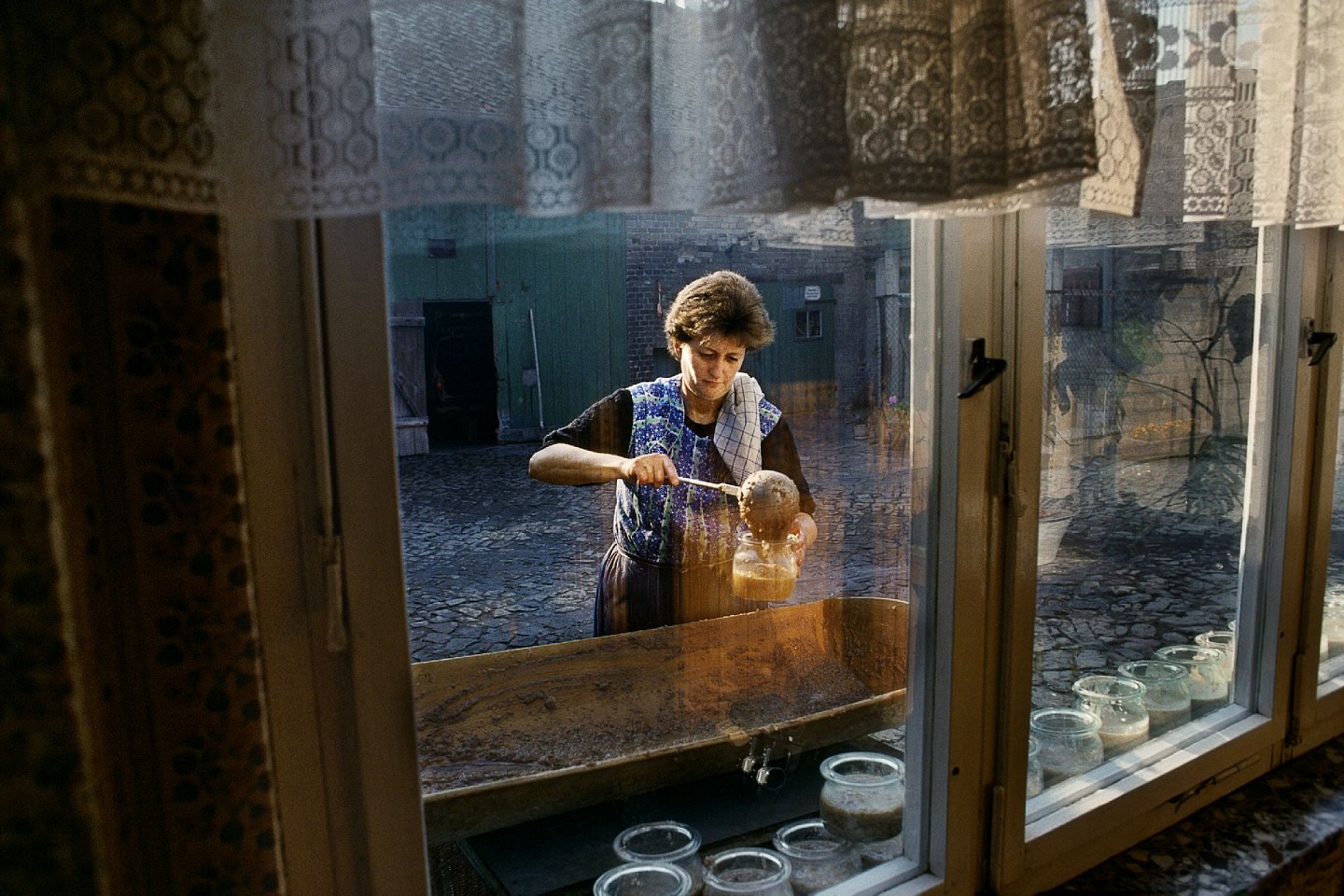 Steve McCurry, Woman Ladles Food into Jars, 1989
FujiFlex Crystal Archive Print
Price/Size on request