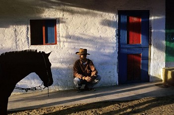 Steve McCurry - Steve McCurry Javier Joven Penangos Waits by Wall